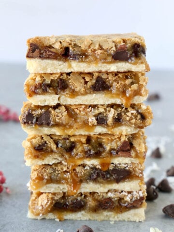 a stack of six bars with caramel drizzling down