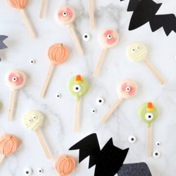 Oreos on popsicle sticks, dipped in chocolate with candy eyes.