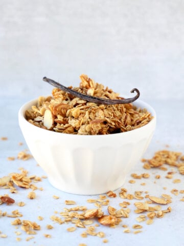 a white bowl filled with granola