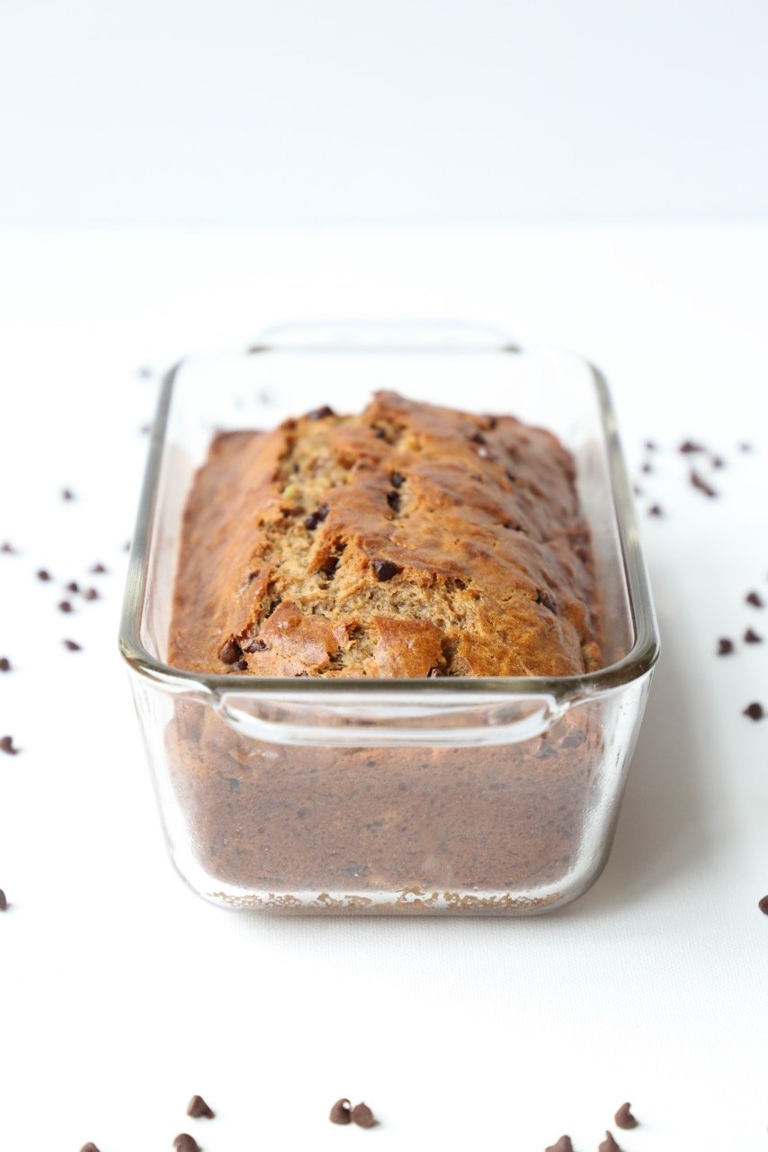 a loaf of banana bread in a glass baking dish 