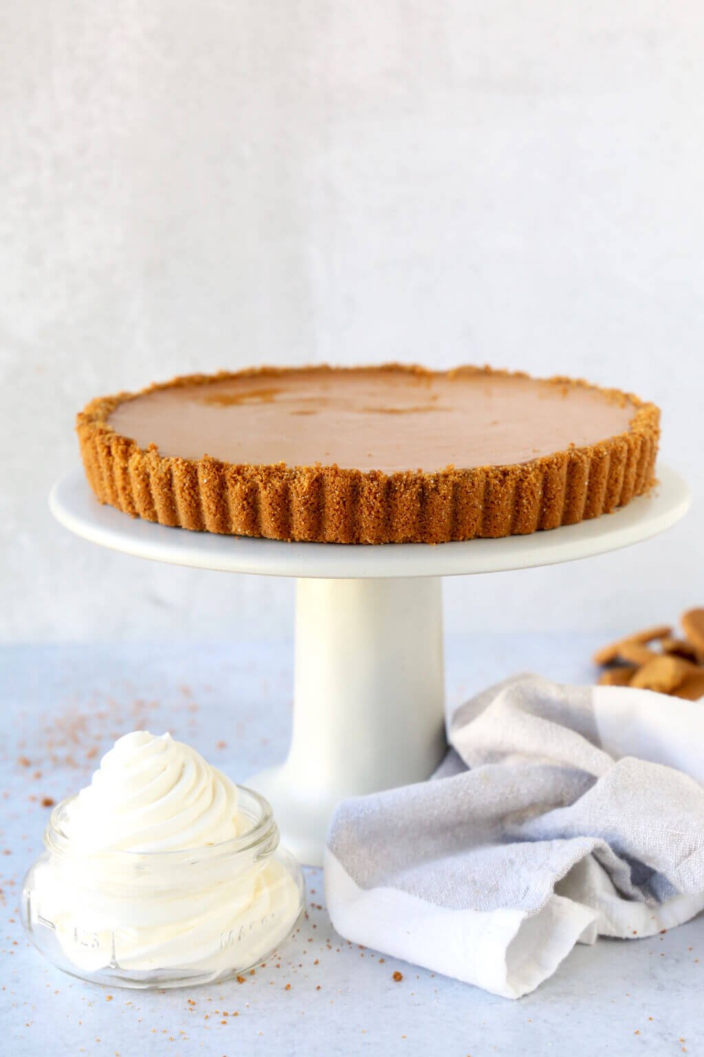 Nine inch pumpkin gingerbread tart on a cake stand