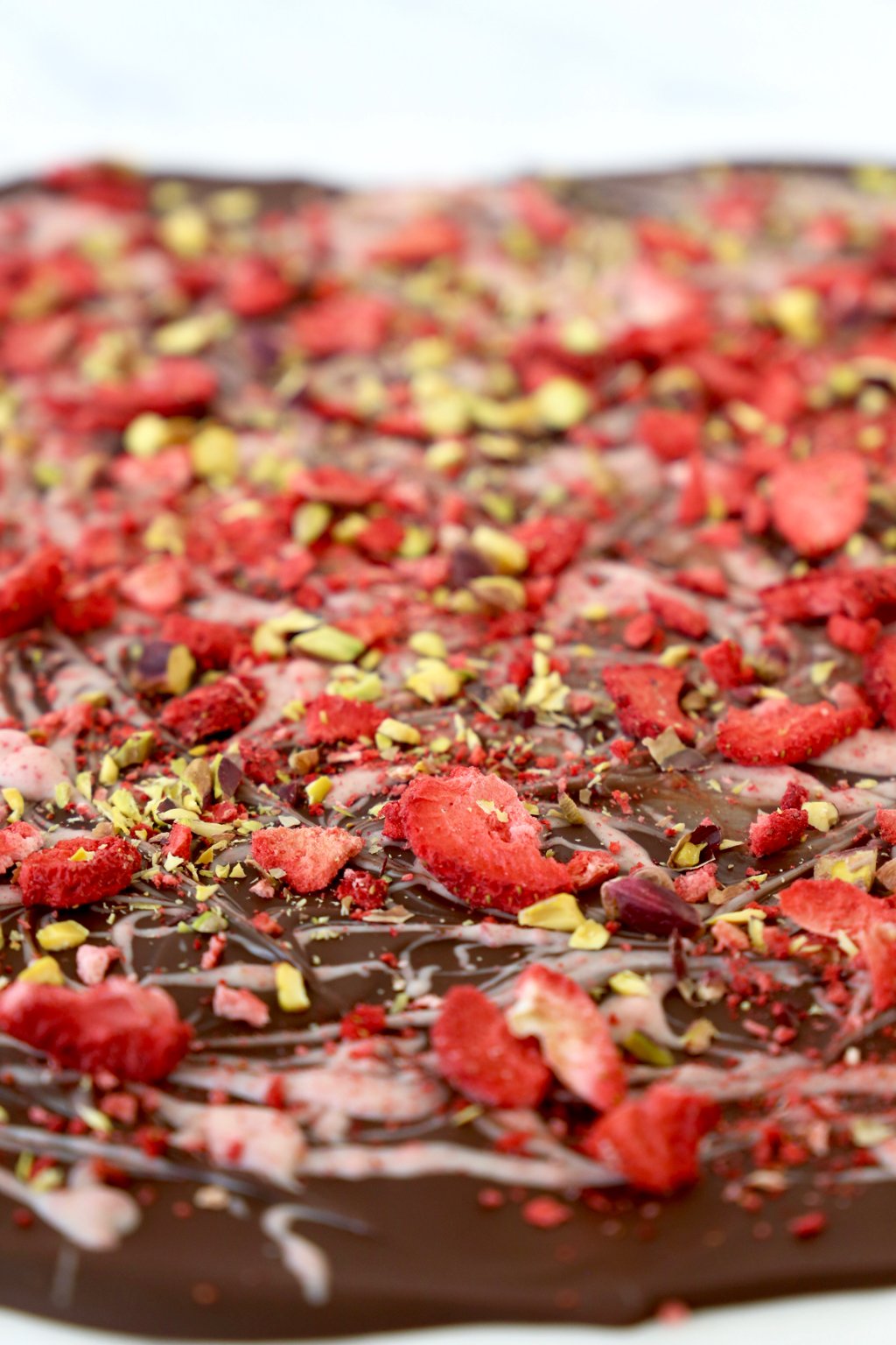 A close up of strawberry pistachio bark