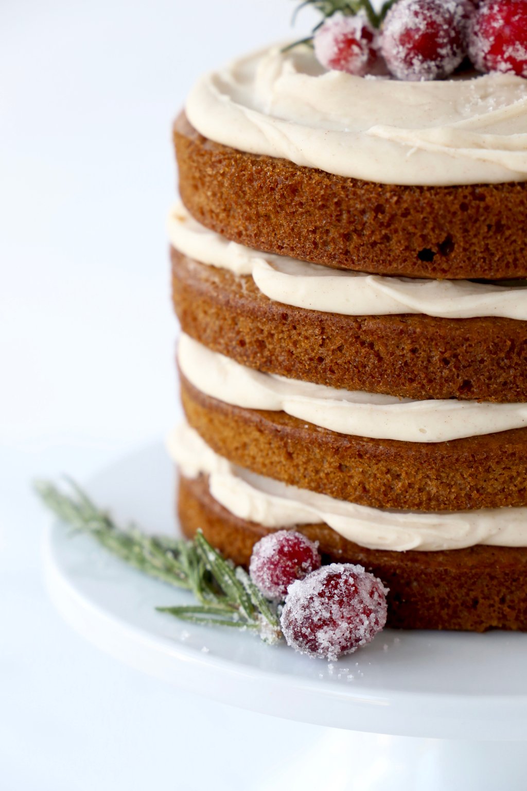 a close up of the layers of gingerbread cake and spiced icing