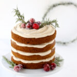 Layers of gingerbread cake and spiced cream cheese icing