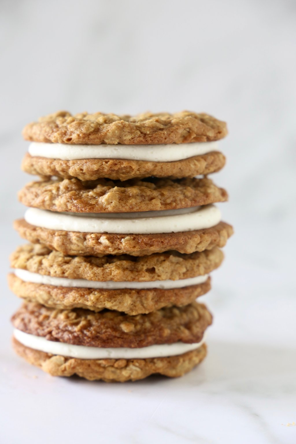 A stack of four sandwiched cookies.  