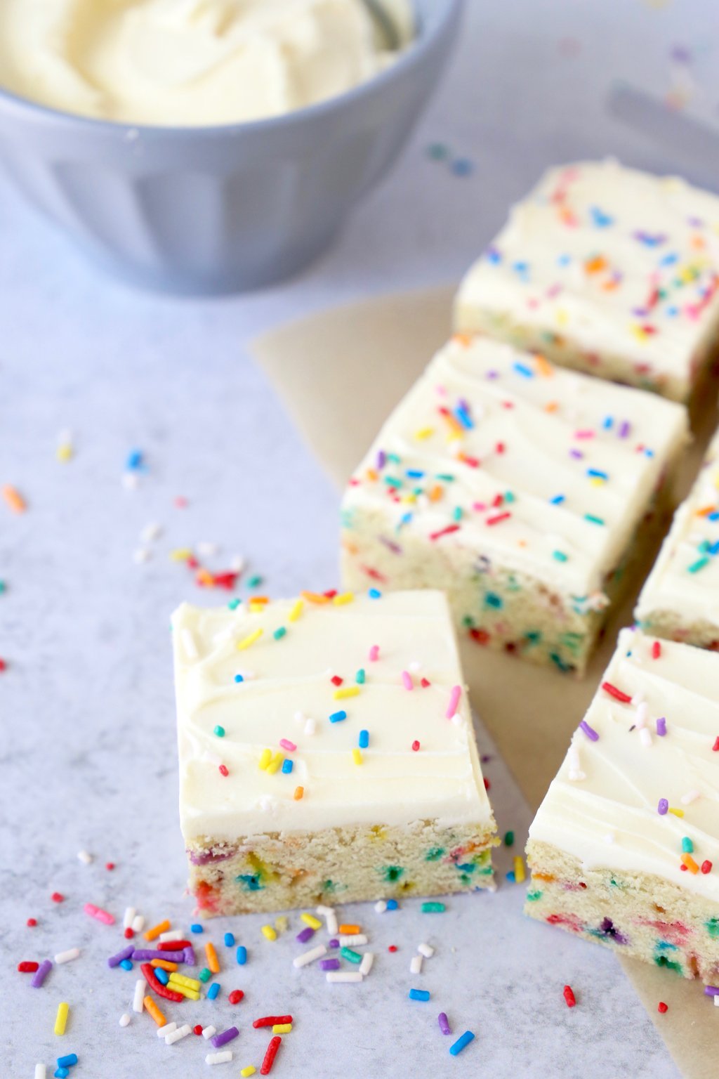 Close up of a sugar cookie bar with rainbow sprinkles on top