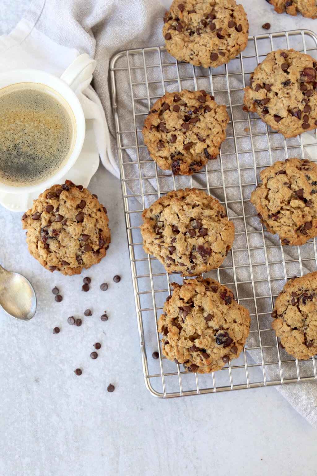 overhead view of breakfast cookies on a cooling rack and a cup of coffee