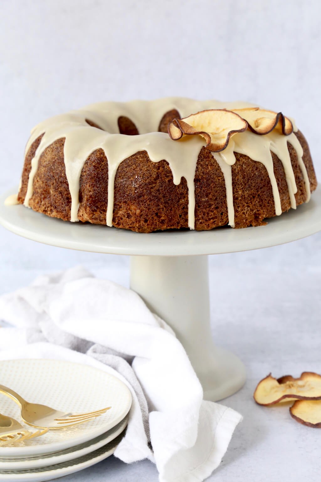 Apple Spice Bundt Cake on top of a cake stand