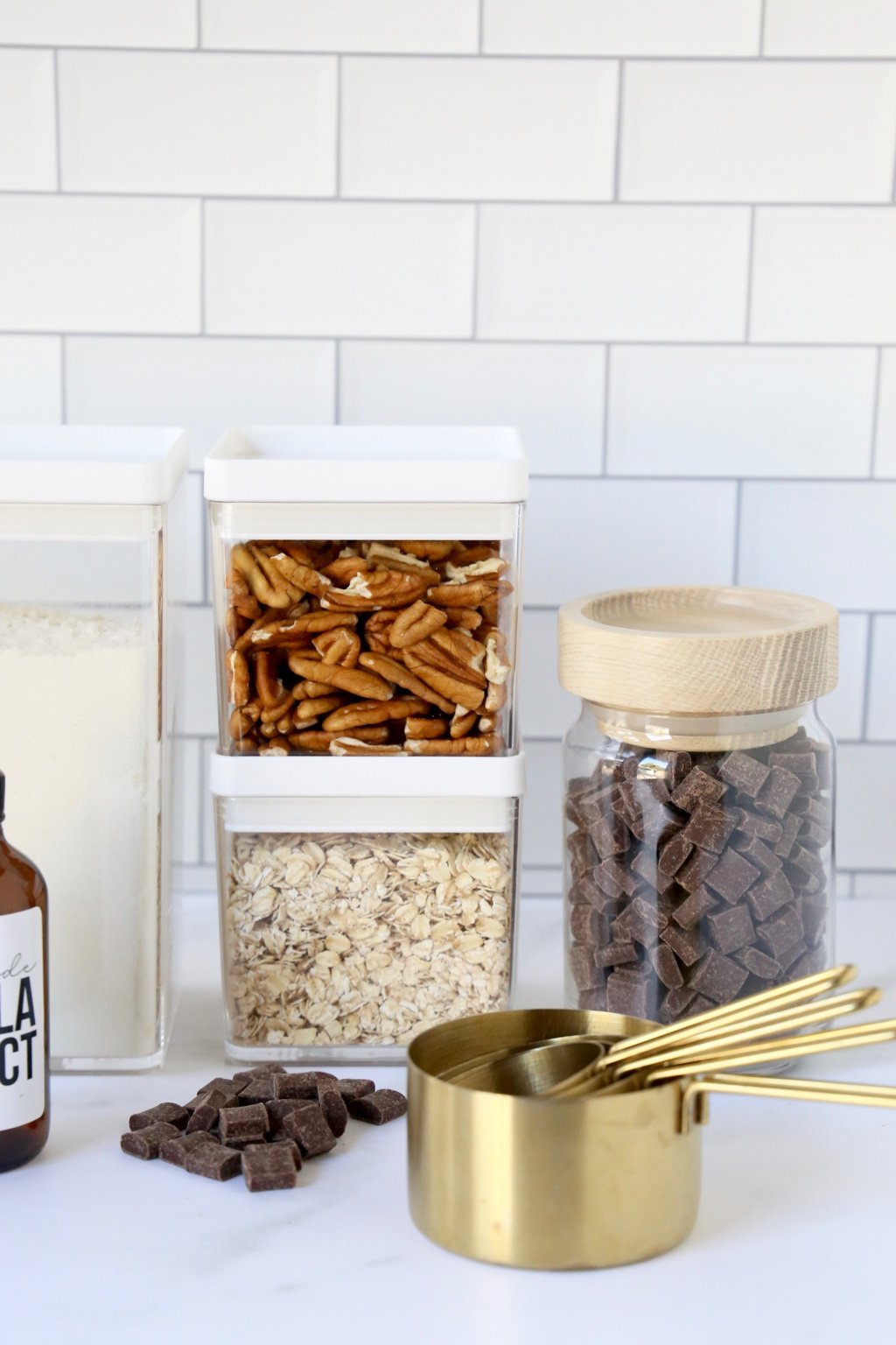 jars of pecan, oats, chocolate chips and measuring cups