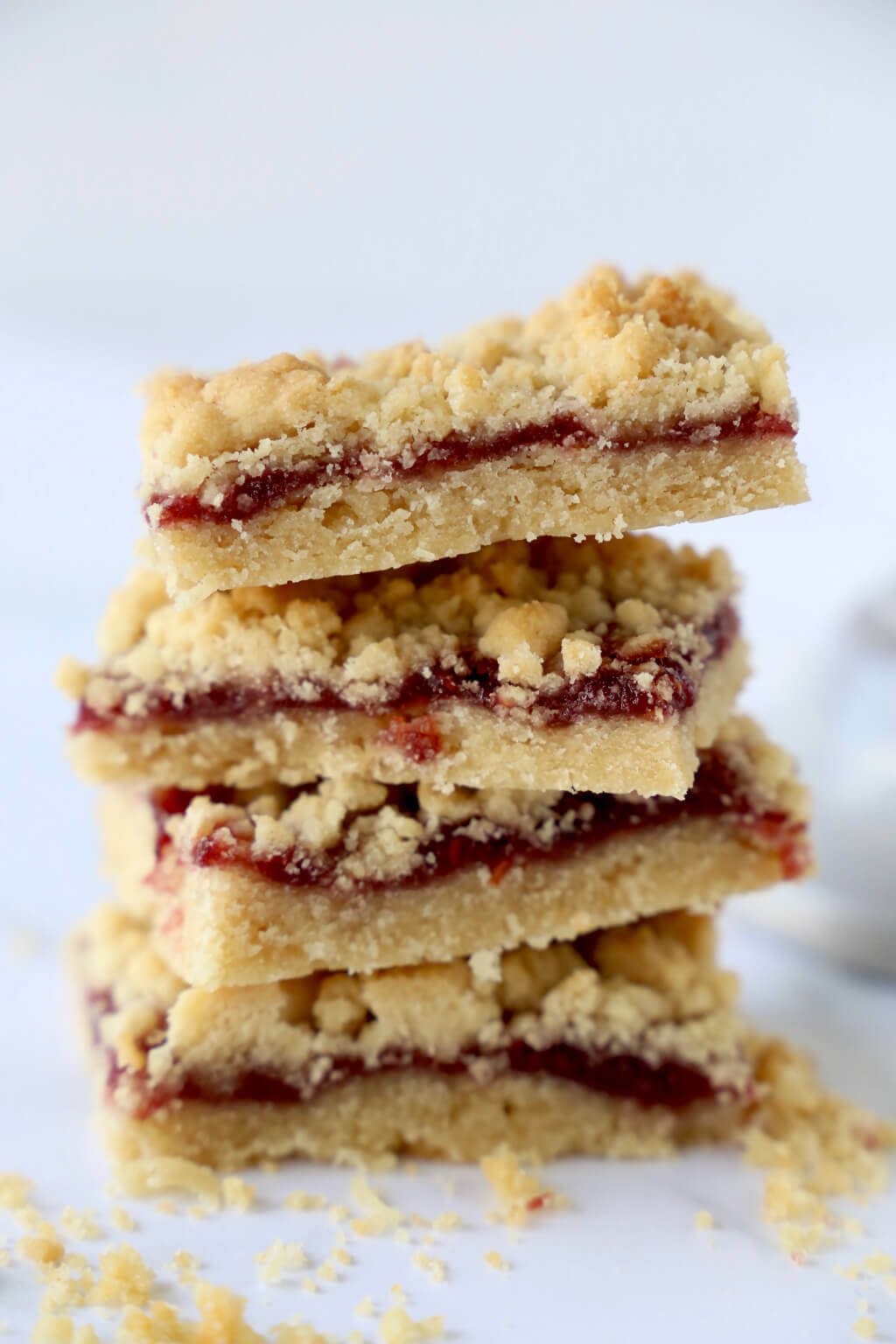 a stack of 4 jam shortbread bars 
