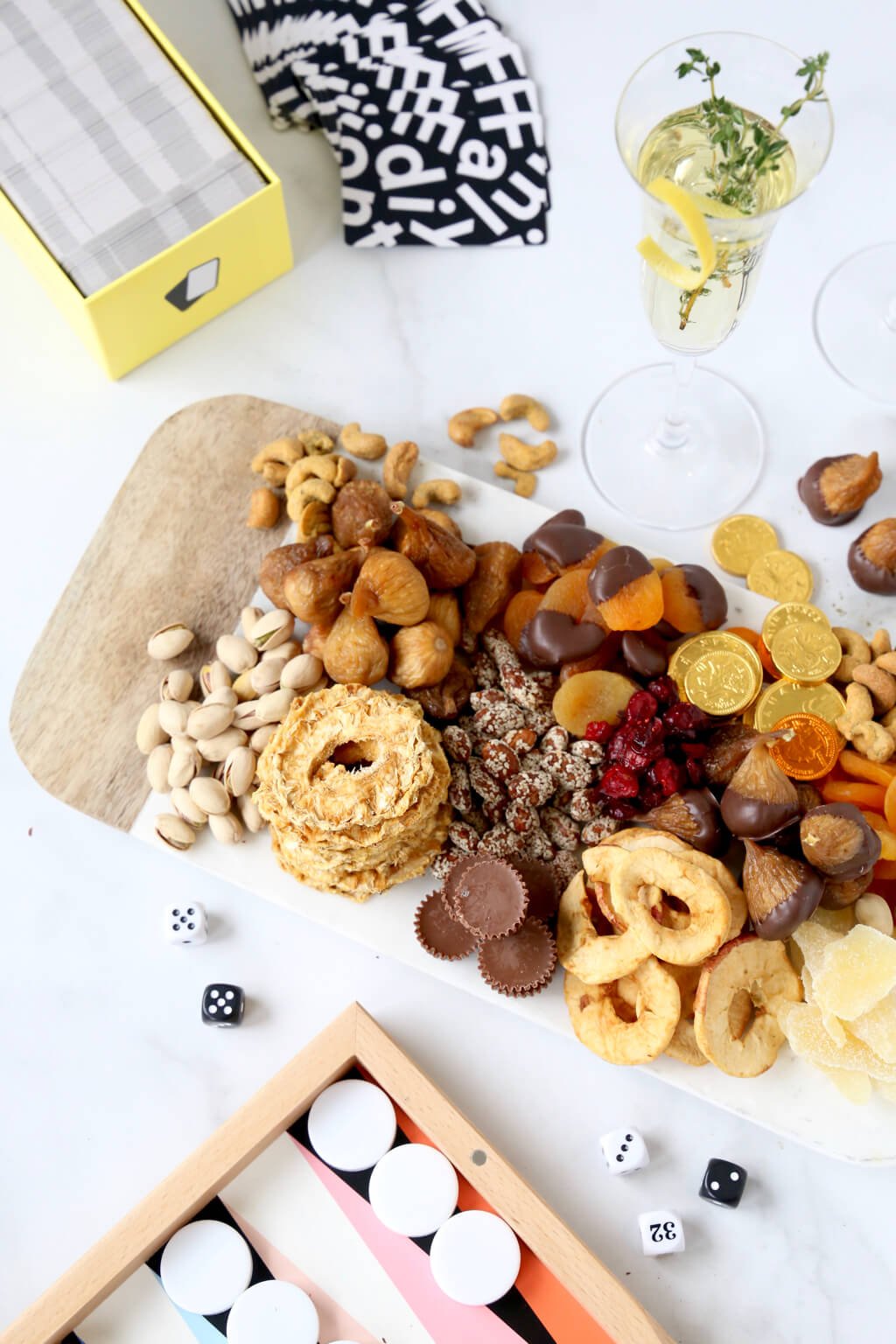 card game, backgammon and a platter of snacks and a glass of champagne