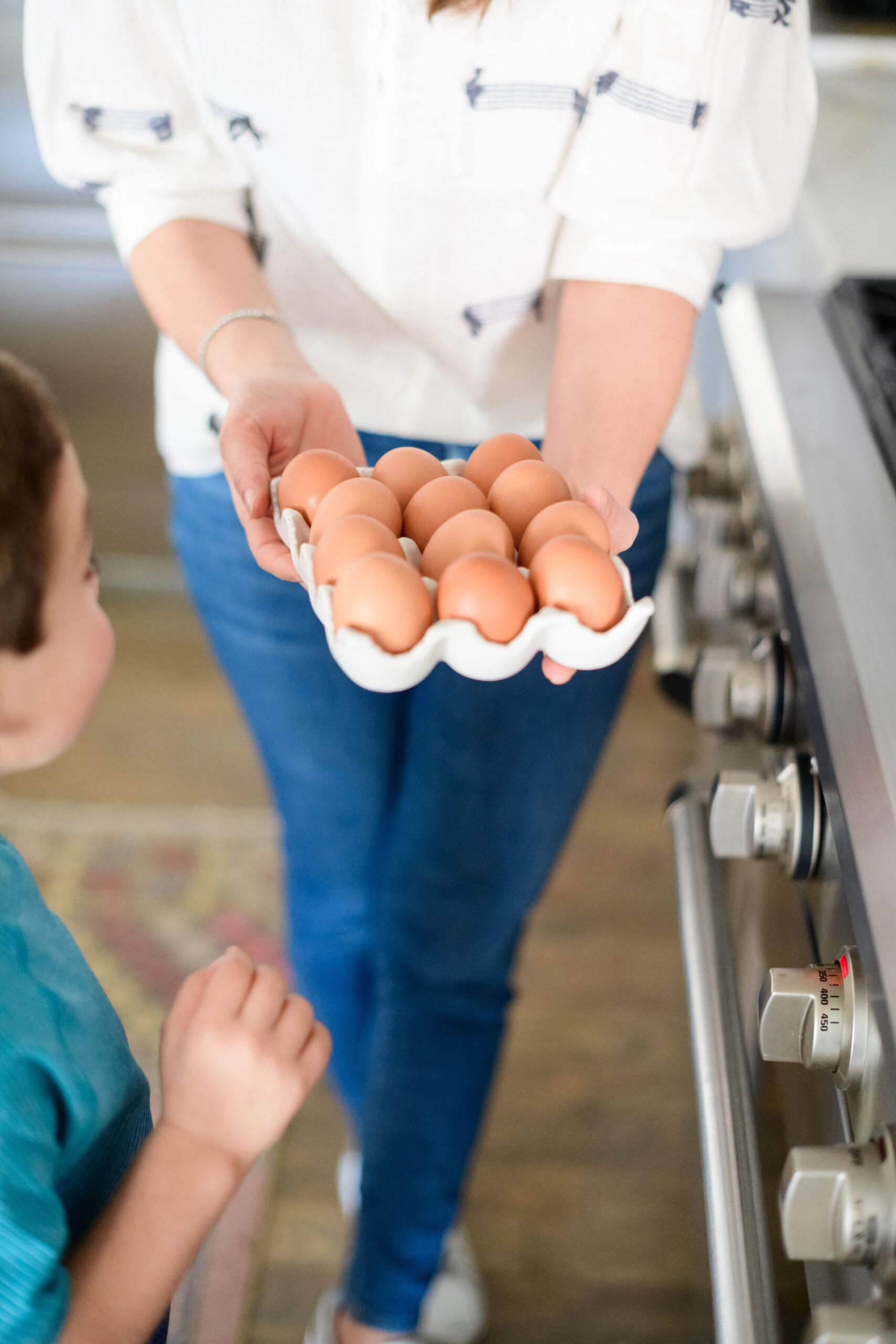 I am holding a porcelain egg dish filled with eggs 