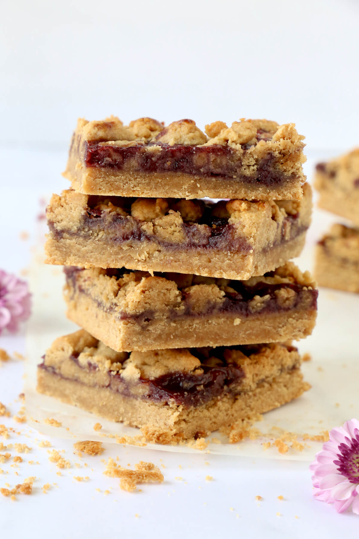 A stack of four peanut butter and jelly bars.  