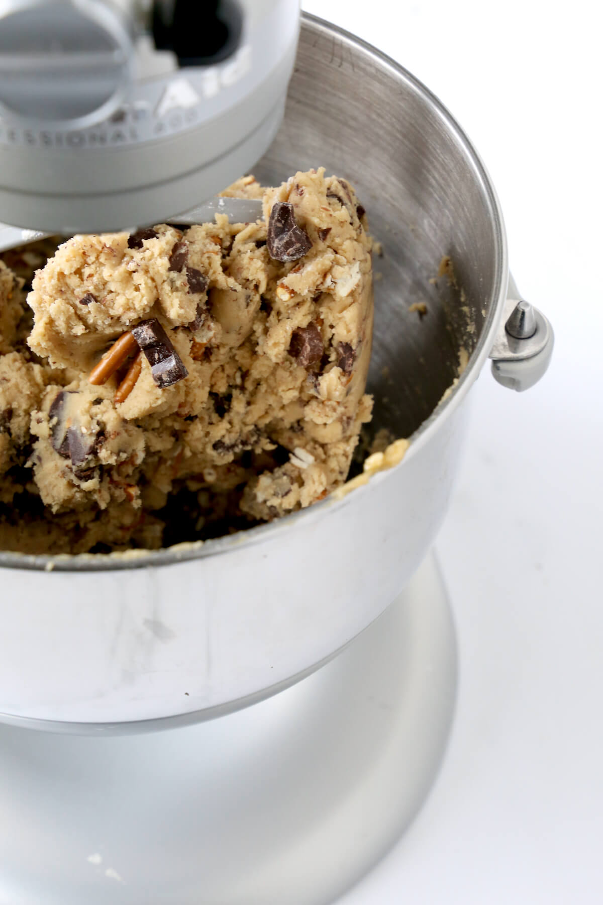 A mixing bowl filled with cookie dough batter. 