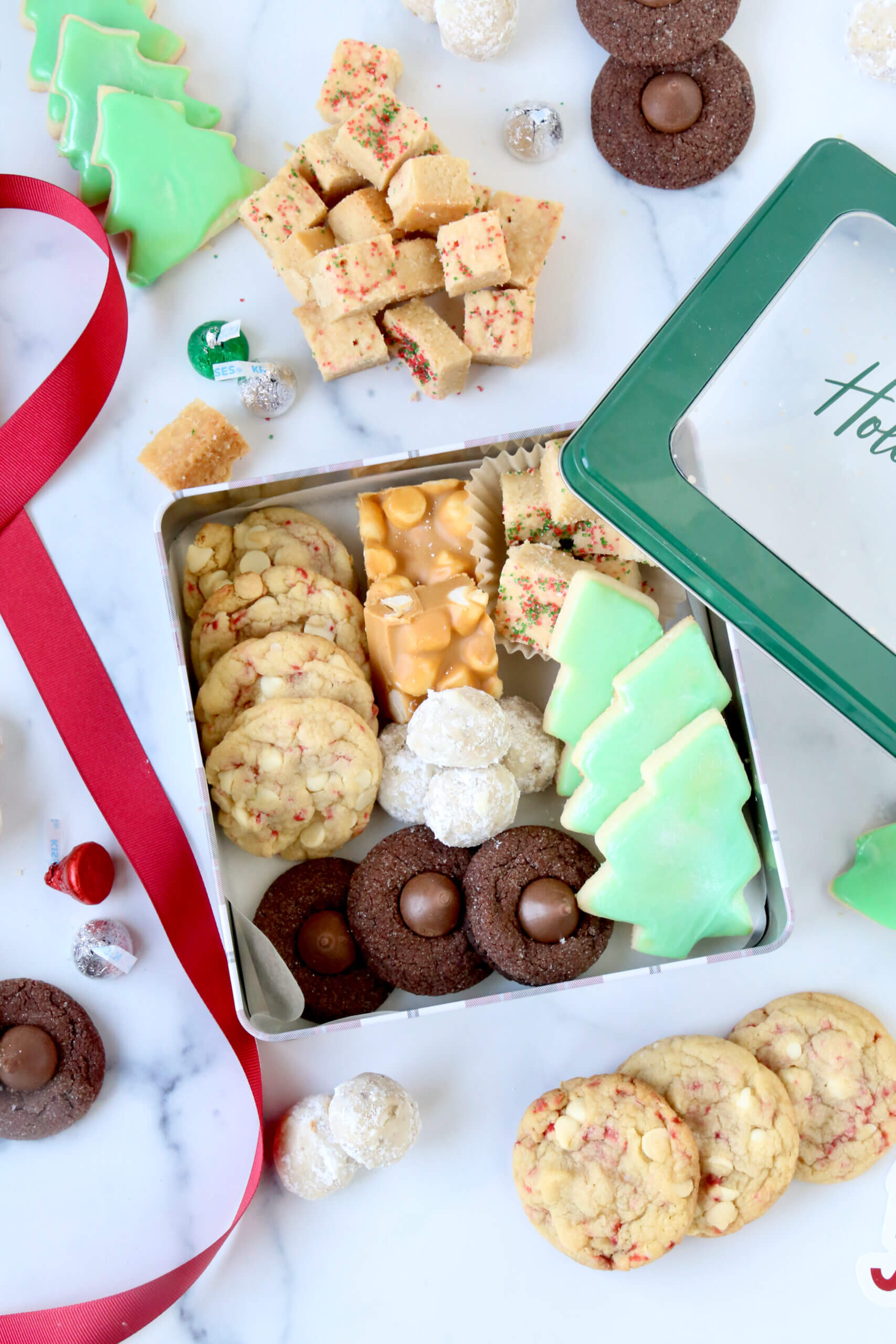 A metal box filled with color cookies. 